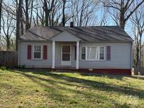 Charming single story house with red shutters and a quaint front porch at 1027 Morningside Park Dr, Gastonia, NC 28054