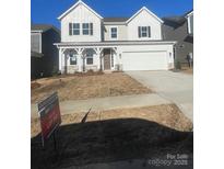 Charming two-story home boasts a two-car garage and a welcoming front porch at 119 Goorawing Ln, Mooresville, NC 28115