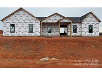 New construction home featuring a modern design, black roof and black trim windows at 1370 Coppergate Dr, Salisbury, NC 28147