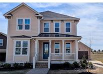 Charming two-story home featuring a welcoming front porch and manicured landscaping at 263 Luray Way # 444, Rock Hill, SC 29730