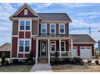 Charming two-story home with a covered porch and landscaped front yard at 267 Luray Way # 445, Rock Hill, SC 29730