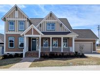 Inviting two-story home with a charming front porch and craftsman-style architecture at 275 Luray Way # 447, Rock Hill, SC 29730