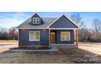 Charming new construction with navy blue siding, crisp white trim, and a covered front entry at 4005 Miller Rd, Salisbury, NC 28147