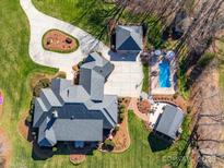 Expansive property featuring a pool, manicured lawns, and mature landscaping at 810 Lake Wright Rd, China Grove, NC 28023