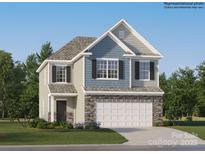 Two-story home with a stone veneer, light blue shingles and a two-car garage for a striking facade at 1816 Otter Perch Ln, Fort Mill, SC 29715