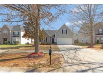 Charming home featuring a well-manicured lawn, a two-car garage, and lovely landscaping, perfect for suburban living at 1911 Kingstree Dr, Monroe, NC 28112