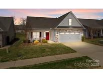 Charming single-Gathering home with stone accents, a red door, and an attached two-car garage at 420 Spring Arbor Ave # 80, Salisbury, NC 28146