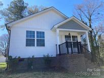 Charming single-Gathering home showcasing a brick foundation and covered front porch entry at 1537 Poston Cir, Gastonia, NC 28054