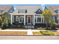 Charming home featuring a cozy front porch with comfortable seating and attractive curb appeal at 21812 Chapel Way # 20, Cornelius, NC 28031