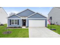 Charming single-story home with blue siding, a two-car garage, manicured lawn, and welcoming front entrance at 2766 Sherrills Stream Dr, Sherrills Ford, NC 28673