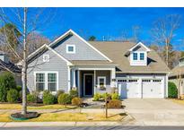 Charming single-Gathering home with a well-manicured lawn and two car garage at 1891 Felts Pkwy, Fort Mill, SC 29715