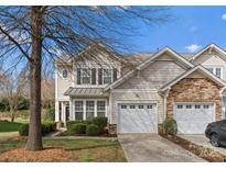 Charming two-story home featuring a two-car garage and manicured landscaping, creating a welcoming curb appeal at 5980 Pale Moss Ln, Charlotte, NC 28269