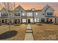 Charming townhome with modern farmhouse design and inviting walkway at 722 Herlong Ave, Rock Hill, SC 29732