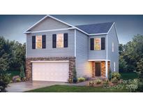 Charming two-story home with stone accents, gray siding, and a well-manicured front yard at 1443 Mammoth Rd, Hickory, NC 28602