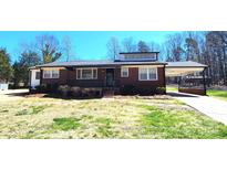 Charming brick ranch-style home with well-maintained landscaping and a convenient carport at 1730 Martin Rd, Kings Mountain, NC 28086