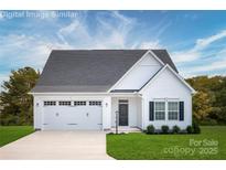 Charming single-story home featuring a white exterior, well-manicured lawn, and an attached two-car garage at 510 Kenyon Dr, Denver, NC 28037