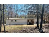 Exterior view of a single story home featuring a small porch and yard with trees at 1151 Bowling Green Dr, Clover, SC 29710