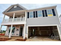 Charming two-story home with open garage, welcoming porch, and available sign at 1440 Ardmore Dr # 343, Sherrills Ford, NC 28673
