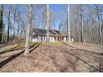 Charming ranch-style home with an attached two-car garage and beautiful trees on a spacious lot at 2010 Creekwood Dr, York, SC 29745