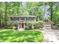 Charming two-story home with a well-manicured lawn, attached garage, and beautiful landscape at 11 Tanglewood Rd, Lake Wylie, SC 29710