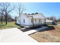 Charming renovated bungalow with a welcoming front porch and a freshly paved driveway at 1018 Union St, Maiden, NC 28650