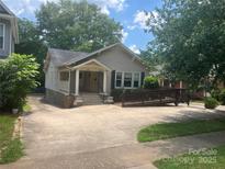 Charming single story home with a welcoming front porch and ramp access for accessibility at 415 W Warren St, Shelby, NC 28150