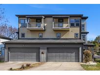 Modern exterior elevation featuring a two-car garage and charming balconies with metal railings at 2709 Yadkin Ave, Charlotte, NC 28205