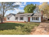 Charming home with a well-maintained lawn, lovely landscaping and a classic white exterior at 4515 Country Meadows Dr, Gastonia, NC 28056