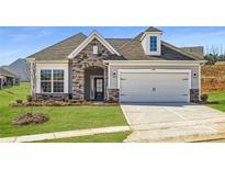 Charming home with a stone facade, two-car garage, and well-manicured lawn at 5926 Oak Branch Cir, Maiden, NC 28650