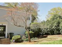 Traditional home with a well-manicured front yard featuring a decorative tree and lush green bushes at 3238 Pinehurst Pl # B, Charlotte, NC 28209