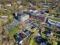 Aerial view of neighborhood including charming home with convenient parking and downtown amenities at 4 Short St, Belmont, NC 28012