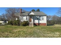 Charming home with a cozy front porch and well-maintained lawn at 514 W Blume St, Landis, NC 28088