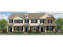 Charming townhouse with brick and siding, featuring black shutters and a well-maintained lawn at 2048 Harlequin Dr, Indian Trail, NC 28079