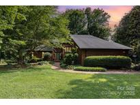 Charming brick home with a well-manicured front yard and inviting walkway at 3004 Vernell Ln, Shelby, NC 28150
