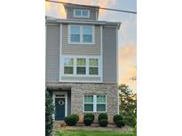 Charming townhouse featuring a brick facade, neutral siding, and neatly trimmed shrubbery at 8232 Waxhaw Hwy, Waxhaw, NC 29173