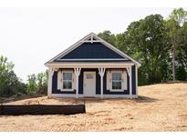 Charming blue home with white trim, a covered porch, and classic design elements at 1432 Blackbird Dr, Clover, SC 29710