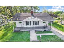 Charming single-story home with inviting front porch and well-manicured lawn at 26 Park Dr, Gastonia, NC 28054
