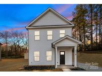 Charming two-story home featuring a modern design and a well-maintained lawn at 607 S 10Th St, Bessemer City, NC 28016