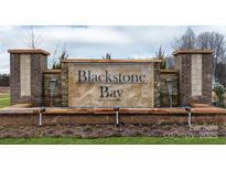 Stone Blackstone Bay entrance sign with water feature and manicured landscaping welcomes residents and guests at 7865 Iron Rd, Sherrills Ford, NC 28673