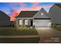 Beautifully landscaped front yard and inviting entrance of the home at 197 Tetcott St, Mooresville, NC 28115