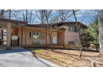 Charming brick home featuring a cozy front porch and a well-maintained landscaped yard at 3407 14Th Sw Ave, Hickory, NC 28602
