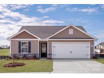 Charming single-story home featuring a two-car garage and a well-maintained lawn at 505 Maddox Dr, Shelby, NC 28152