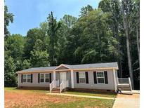 Charming single-story home features a well-maintained yard and inviting front entrance at 185 Crystal Bay Dr, Mooresville, NC 28115