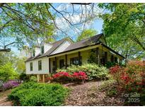 Charming home with inviting front porch and colorful landscaping at 3707 Banyon Nw Ct, Concord, NC 28027