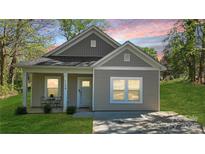 Charming single-story home features a cozy front porch and well-maintained lawn at 1124 Clouse St, Gastonia, NC 28052