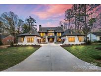 Stunning two-story home features a symmetrical design, stone accents, and a spacious driveway at 238 N Canterbury Rd, Charlotte, NC 28211