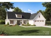 Charming home with a black roof, white siding, and well-manicured lawn at 36482 Rocky River Springs Rd, Norwood, NC 28128