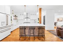 Open kitchen featuring a large island, stainless appliances, and an undermount sink at 170 Della Dr, Statesville, NC 28625