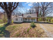 Charming single-story home with covered parking and mature trees in a quiet setting at 28120 Ryan Rd, Richfield, NC 28137