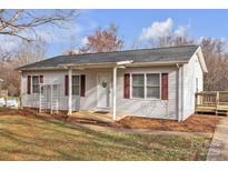 Charming single-story home with light siding, red shutters, and a welcoming front porch at 59 Timothy Dan Ln, Taylorsville, NC 28681